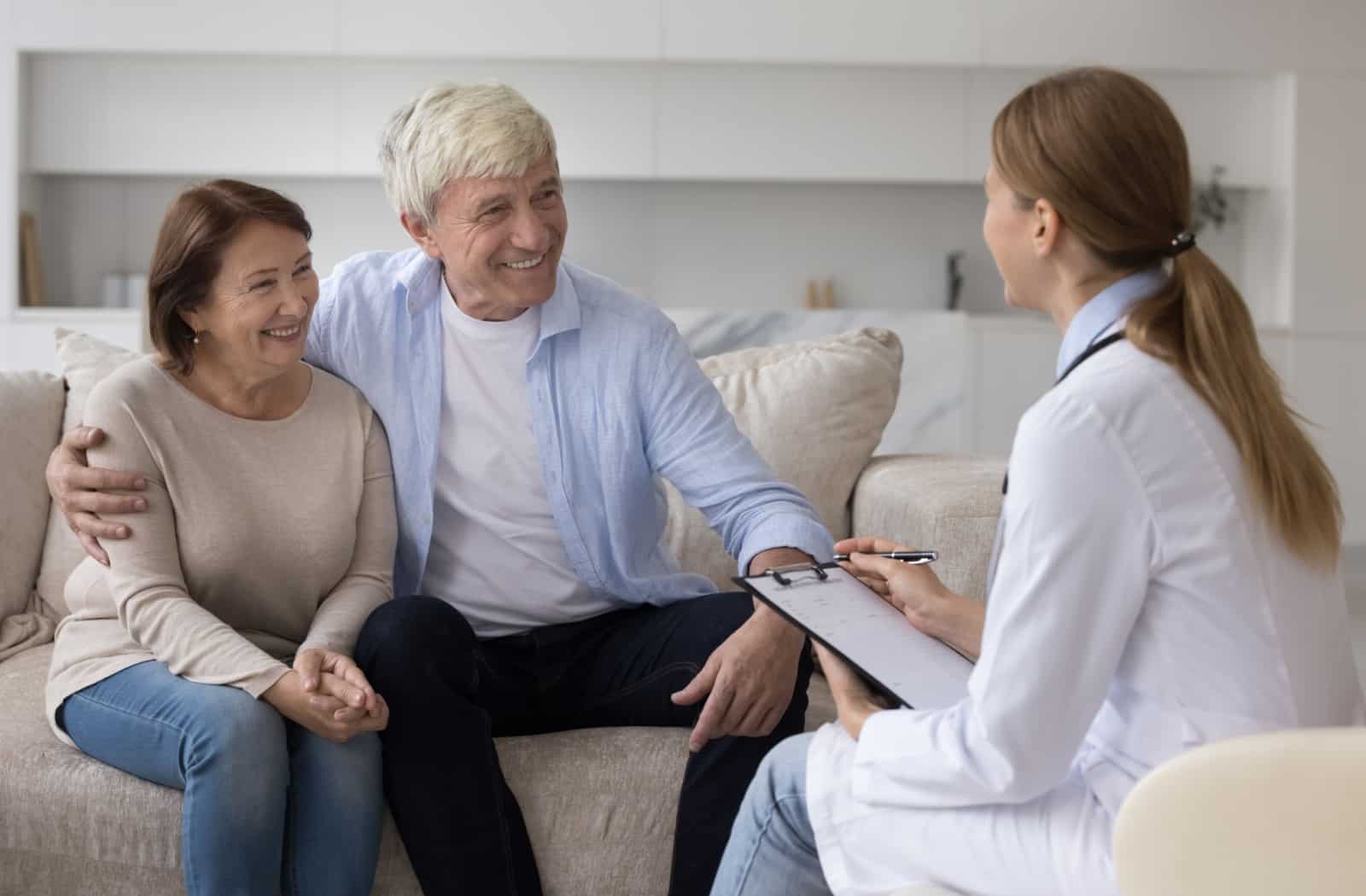 A senior couple chats with a doctor about a new dementia diagnosis and what that could mean for memory care support